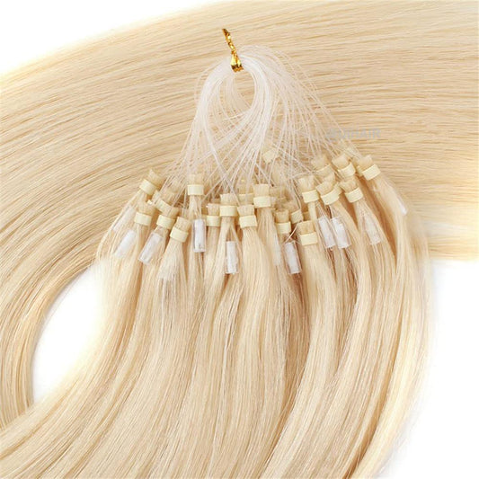 Close-up of light-toned silicone-lined beads for blonde extensions