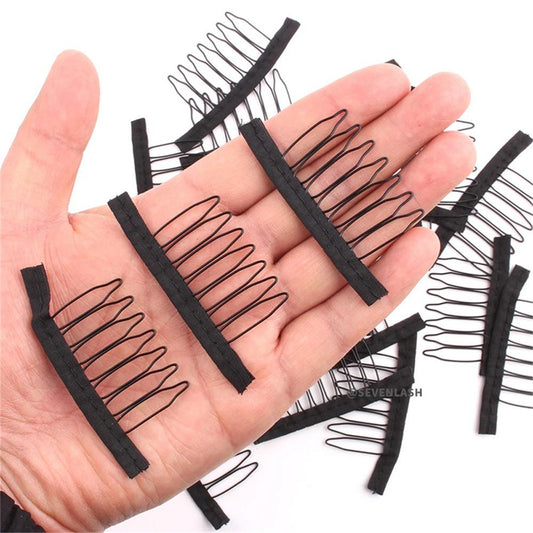 Black-steel-wig-comb-held-in-hand-showing-size-scale