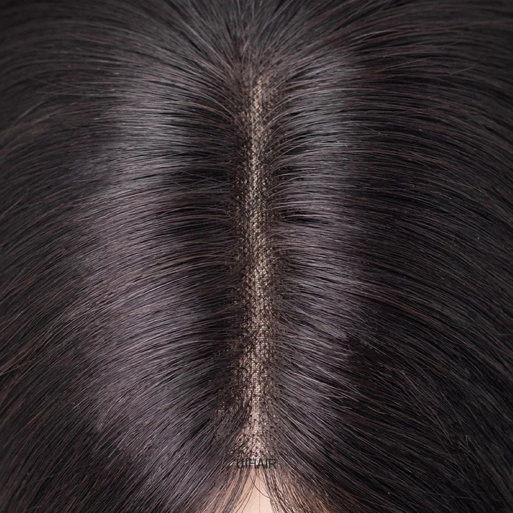 Premium monofilament base hair topper close-up showing hand-tied hair mimicking real scalp