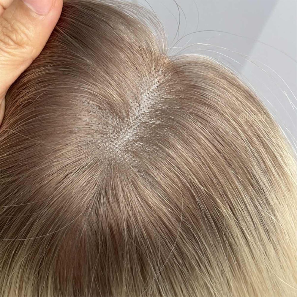 UIHAIR 4x5 Bead-In Virgin Human Hair Topper on model showing a perfectly blended, natural-looking crown part.
