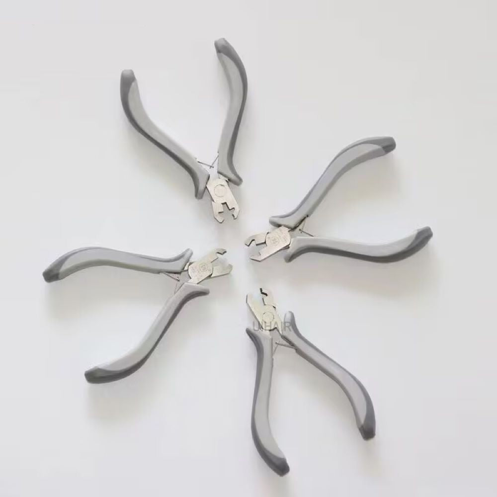 Ergonomic grey and white handles of hair extension pliers.