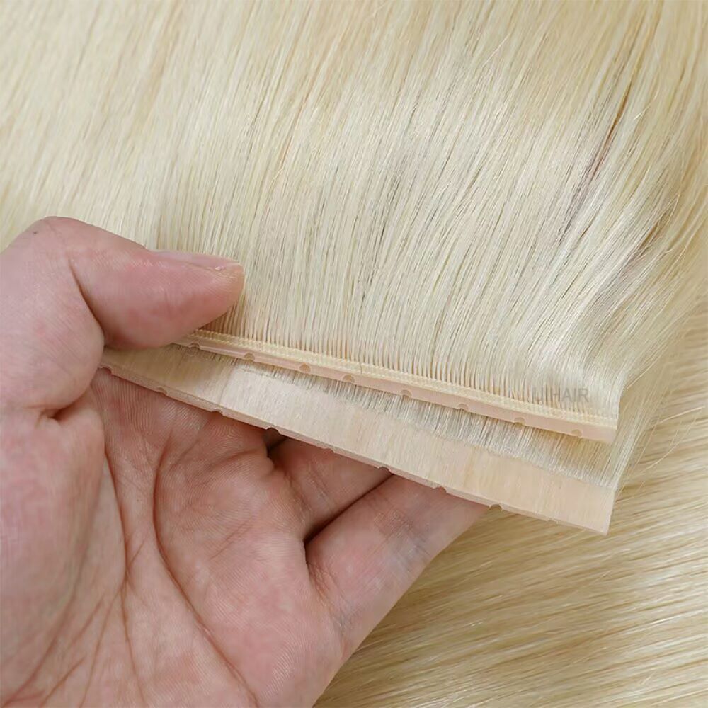 Close up of light toned genius PU double sided hair track with pre perforated micro holes for blonde hair