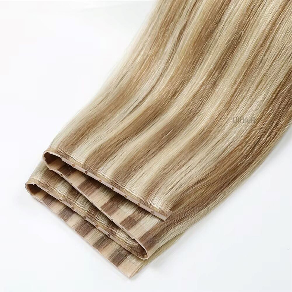 Close up of multi tonal piano highlight hair track featuring integrated micro holes and genius PU seam
