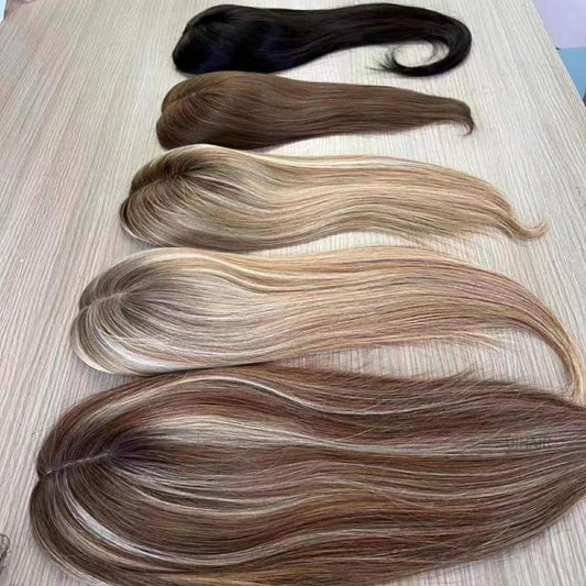 Top-down view of realistic hair parting on silk base hairpiece