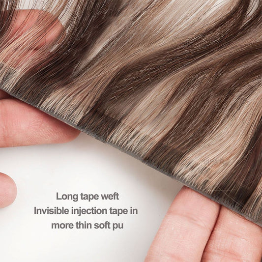 Close up of professional transparent double sided replacement tape being applied onto a reusable skin weft base.