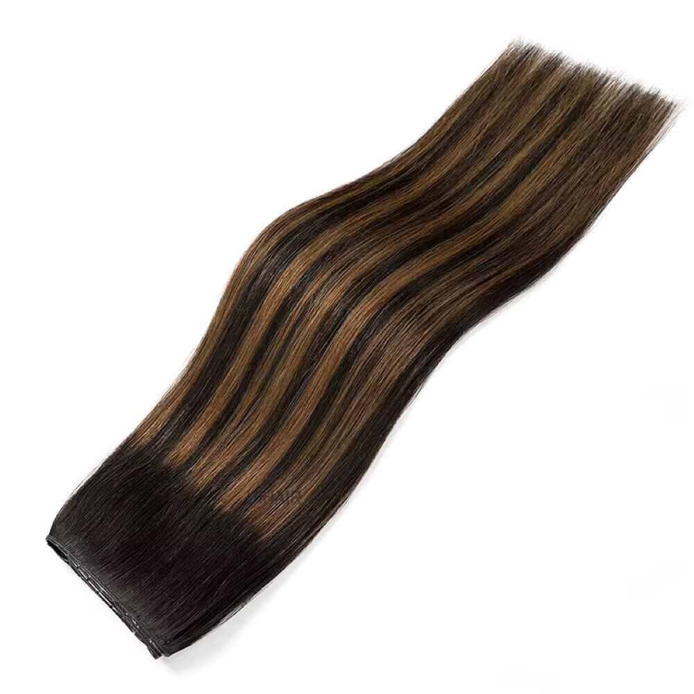 Close up view of dark color matched genius PU hair track with integrated micro holes for ombre hair