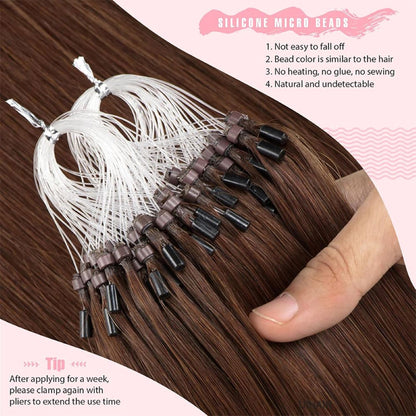 Close-up of silicone-lined rings on brown human hair extensions