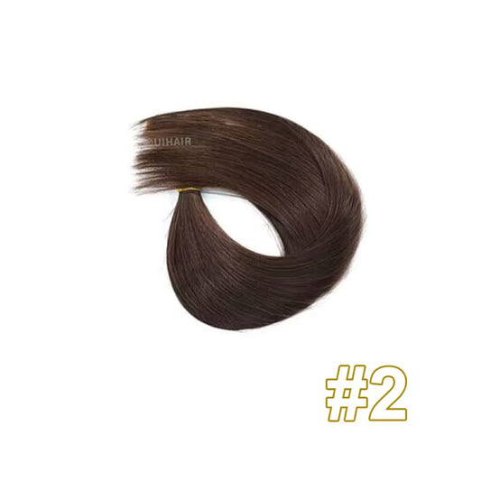 Clip-in hair extensions blending with natural brown hair